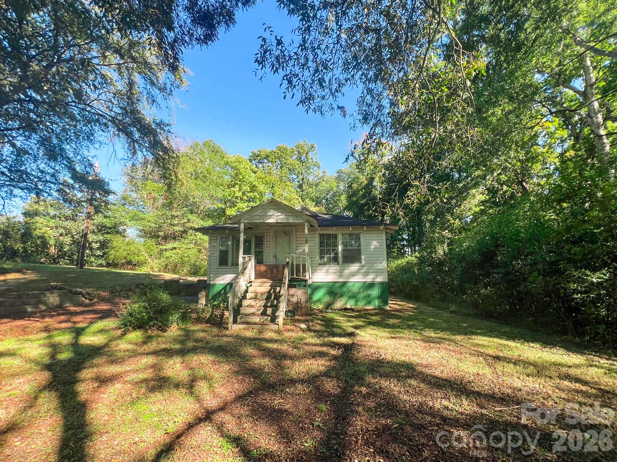 122 Ranson Road Lancaster, SC 29720 - Photo 1 of 19 a view of a wooden house with a yard