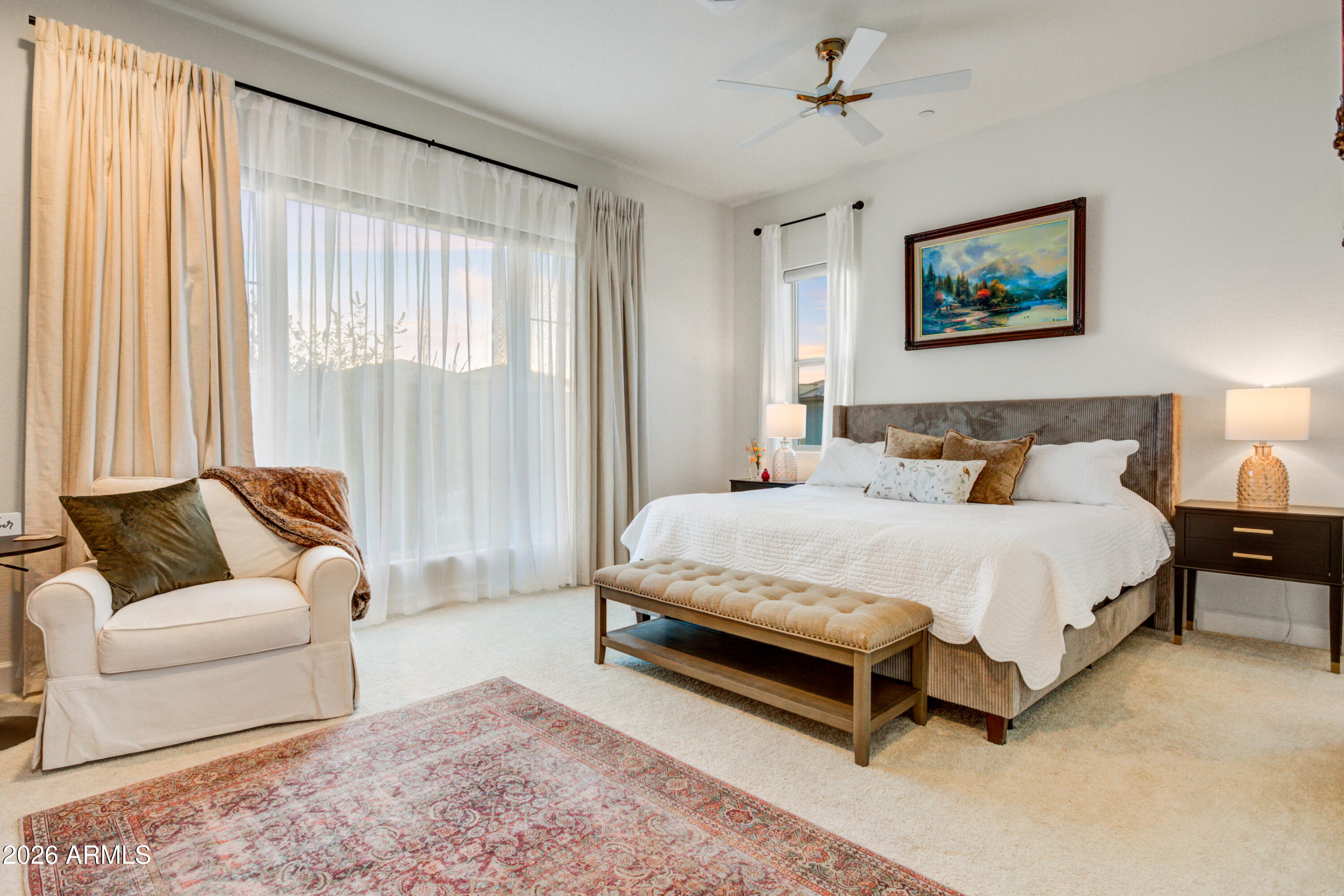 28517 North Camel Rock Court Rio Verde, AZ 85263 - Photo 24 of 39 a spacious bedroom with a bed and glass window