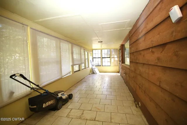 a view of a hallway with windows