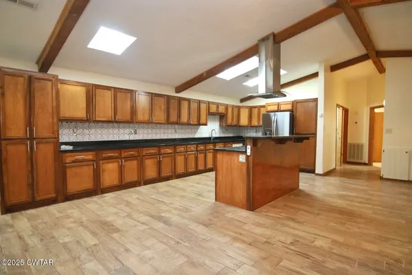 a view of kitchen with cabinets