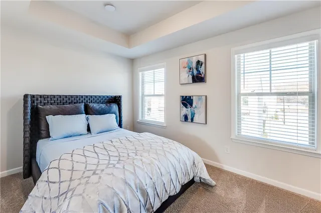 a bedroom with a bed and a mirror