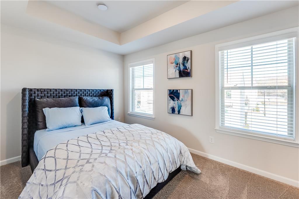 1634 Halbrook Place Southwest Marietta, GA 30008 - Photo 14 of 34 a bedroom with a large bed and a window