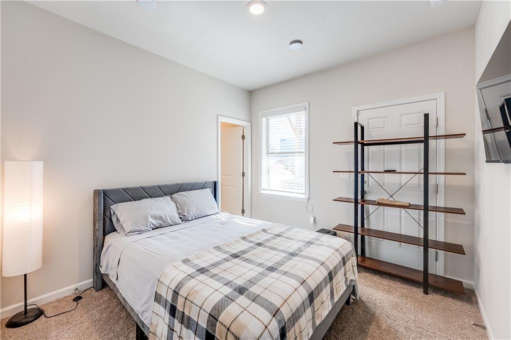 1634 Halbrook Place Southwest Marietta, GA 30008 - Photo 26 of 34 a bedroom with a bed and a window