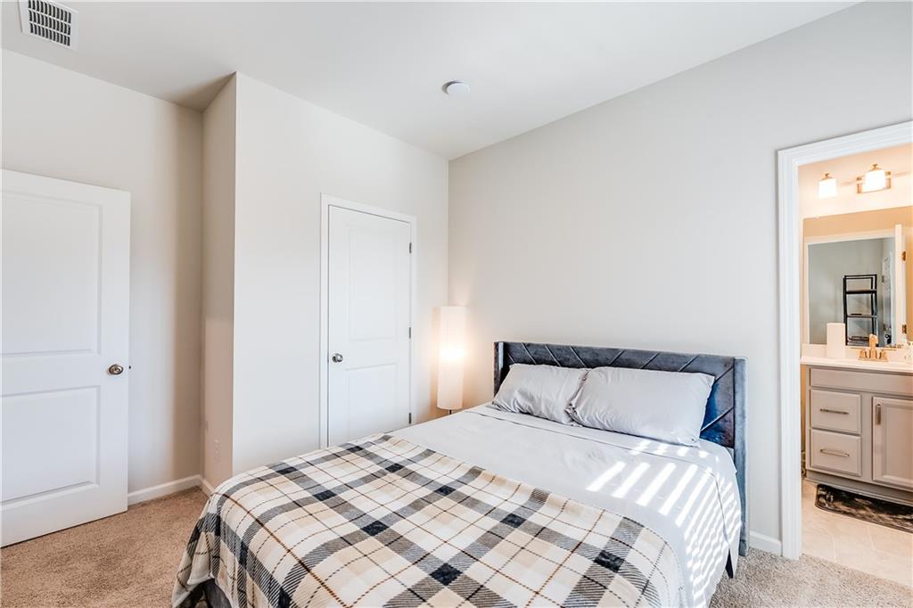 1634 Halbrook Place Southwest Marietta, GA 30008 - Photo 27 of 34 a bedroom with a bed and a closet