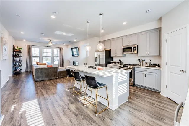 a room with a bed furniture and a flat screen tv