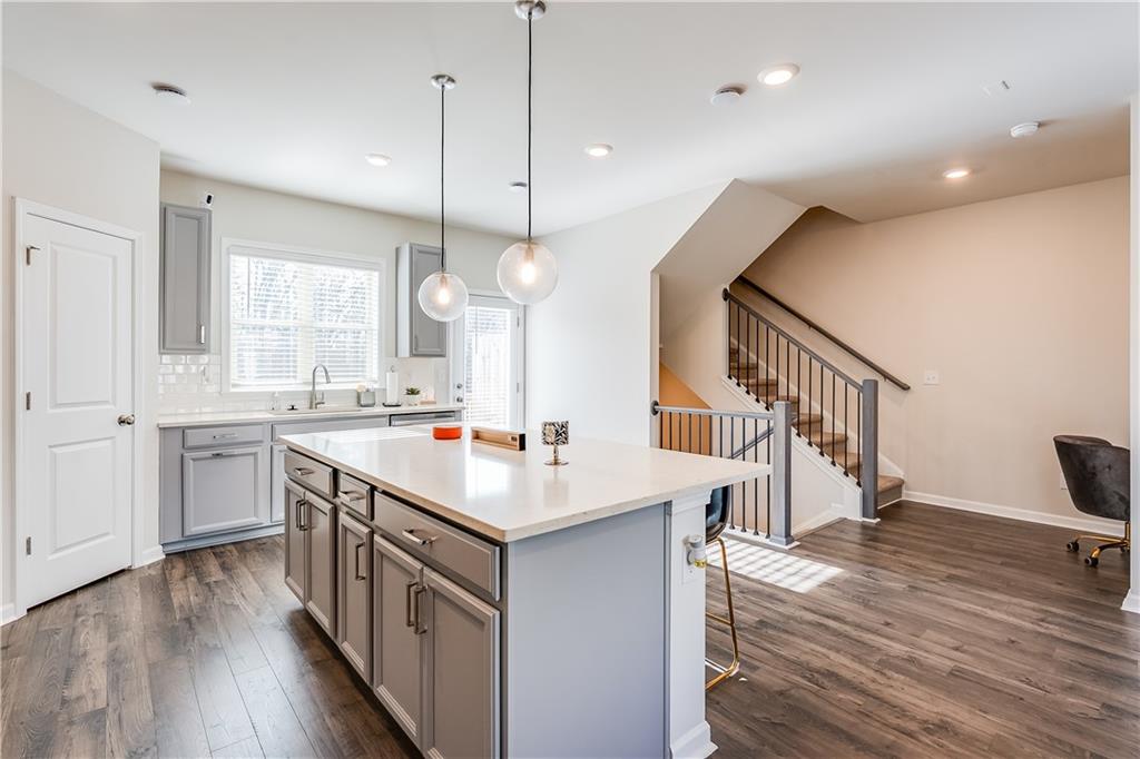 1634 Halbrook Place Southwest Marietta, GA 30008 - Photo 6 of 34 a kitchen with a sink and wooden floor