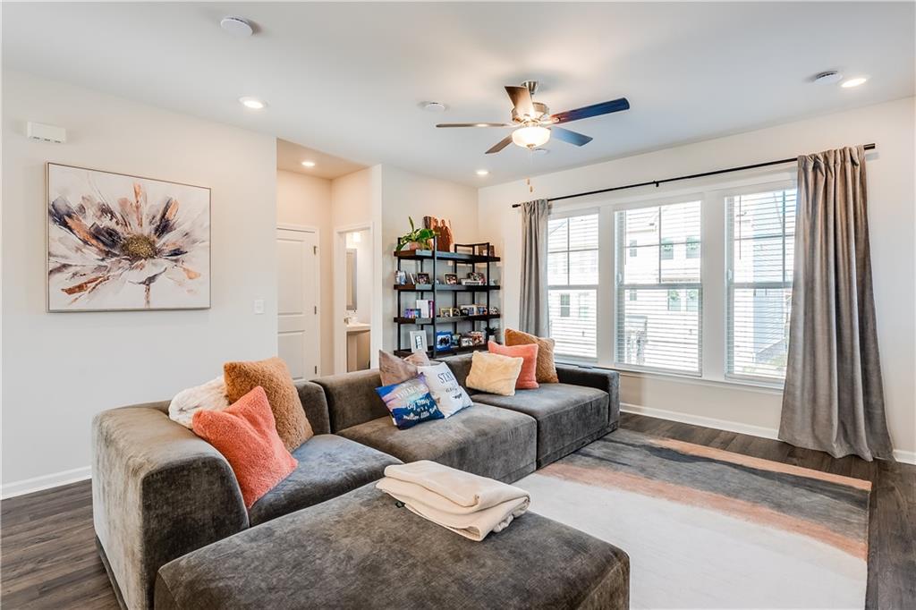 1634 Halbrook Place Southwest Marietta, GA 30008 - Photo 7 of 34 a living room with furniture and a large window