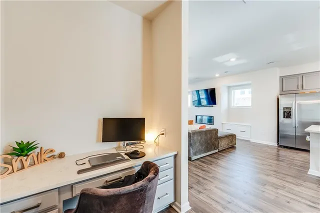 a kitchen with a sink a counter top space stainless steel appliances and cabinets