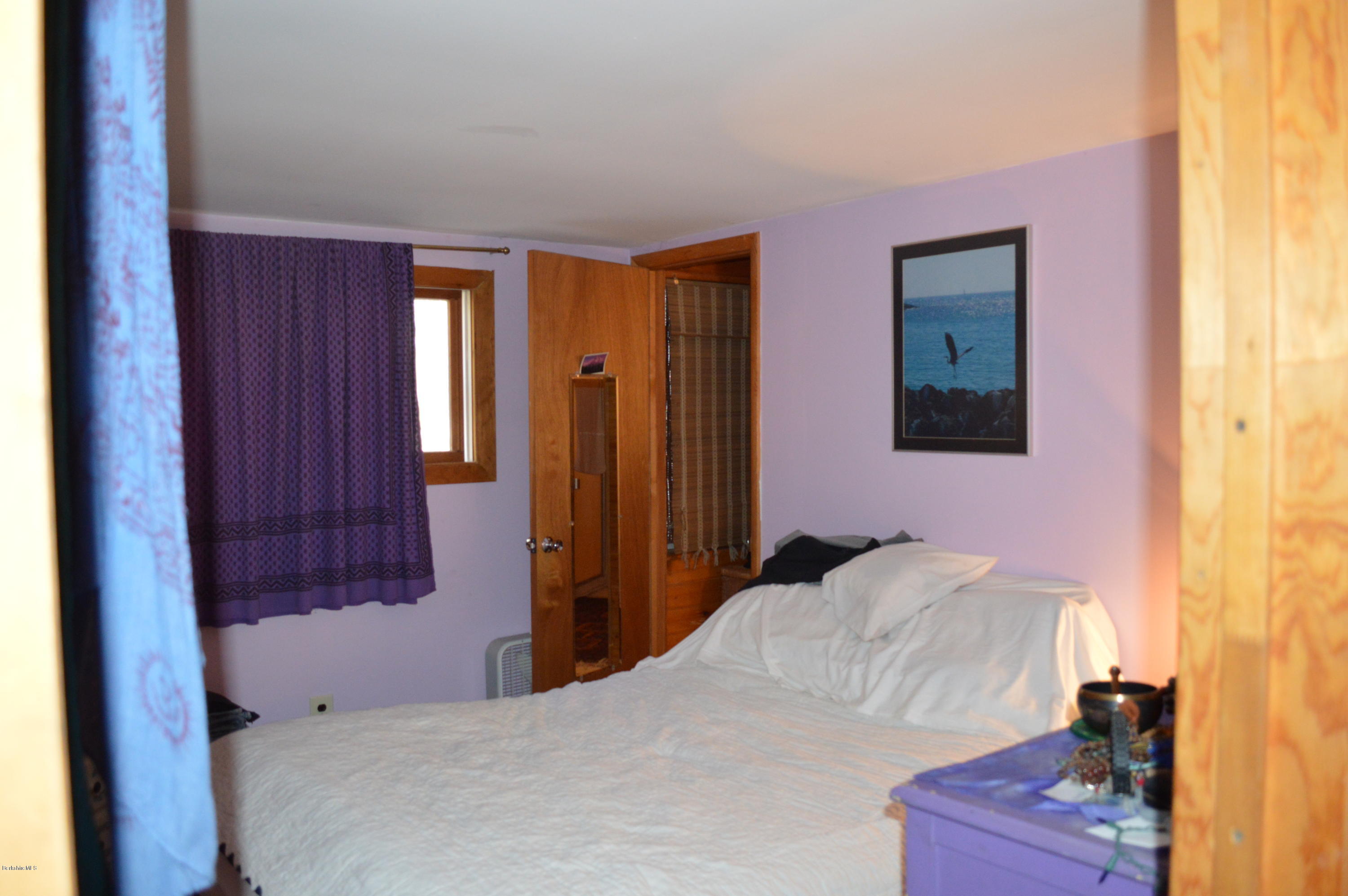 81 Peterson Road Becket, MA 01223 - Photo 13 of 24 a bedroom with a bed and a closet