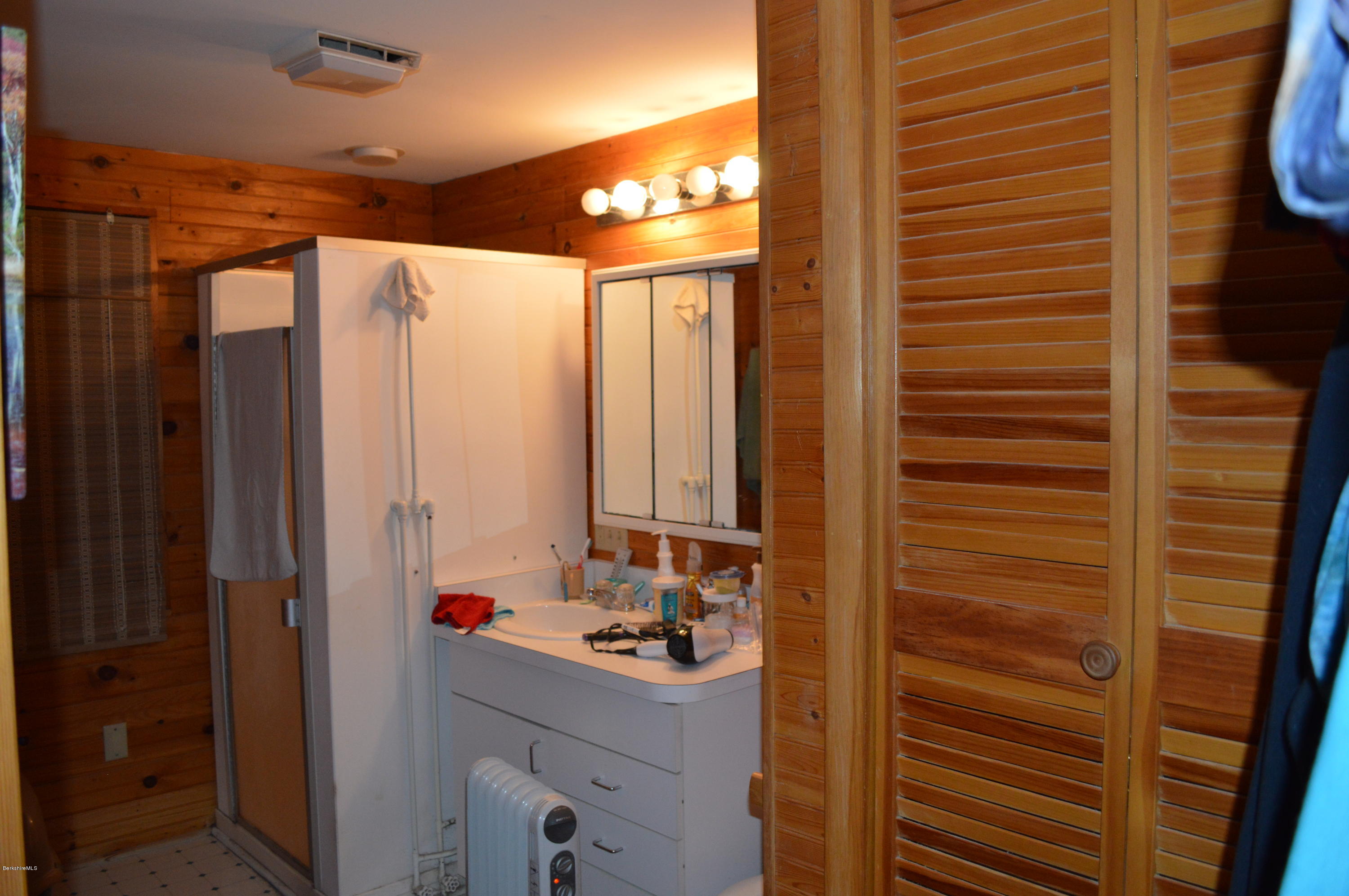 81 Peterson Road Becket, MA 01223 - Photo 14 of 24 a bathroom with a sink and a mirror