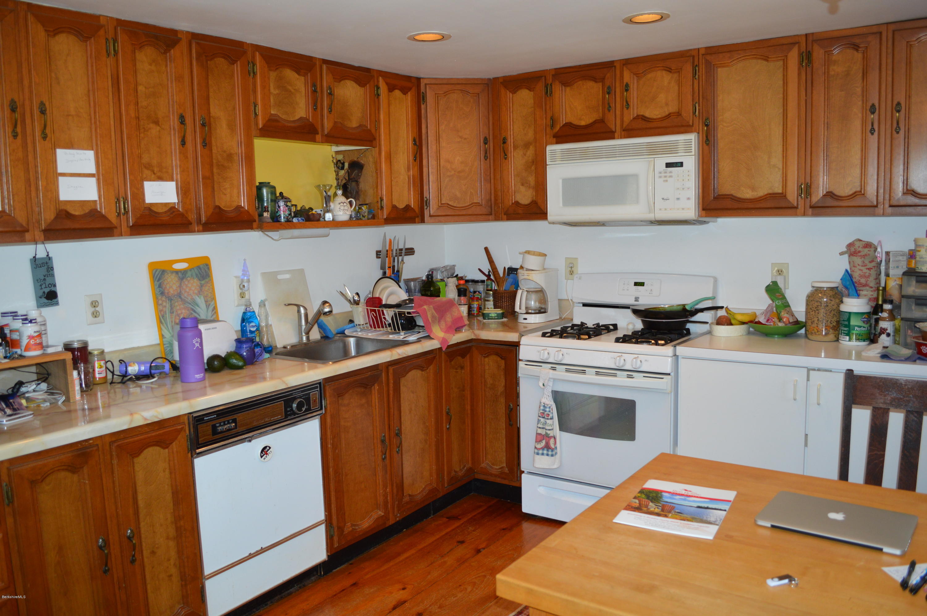 81 Peterson Road Becket, MA 01223 - Photo 19 of 24 a kitchen with stainless steel appliances a stove sink and cabinets