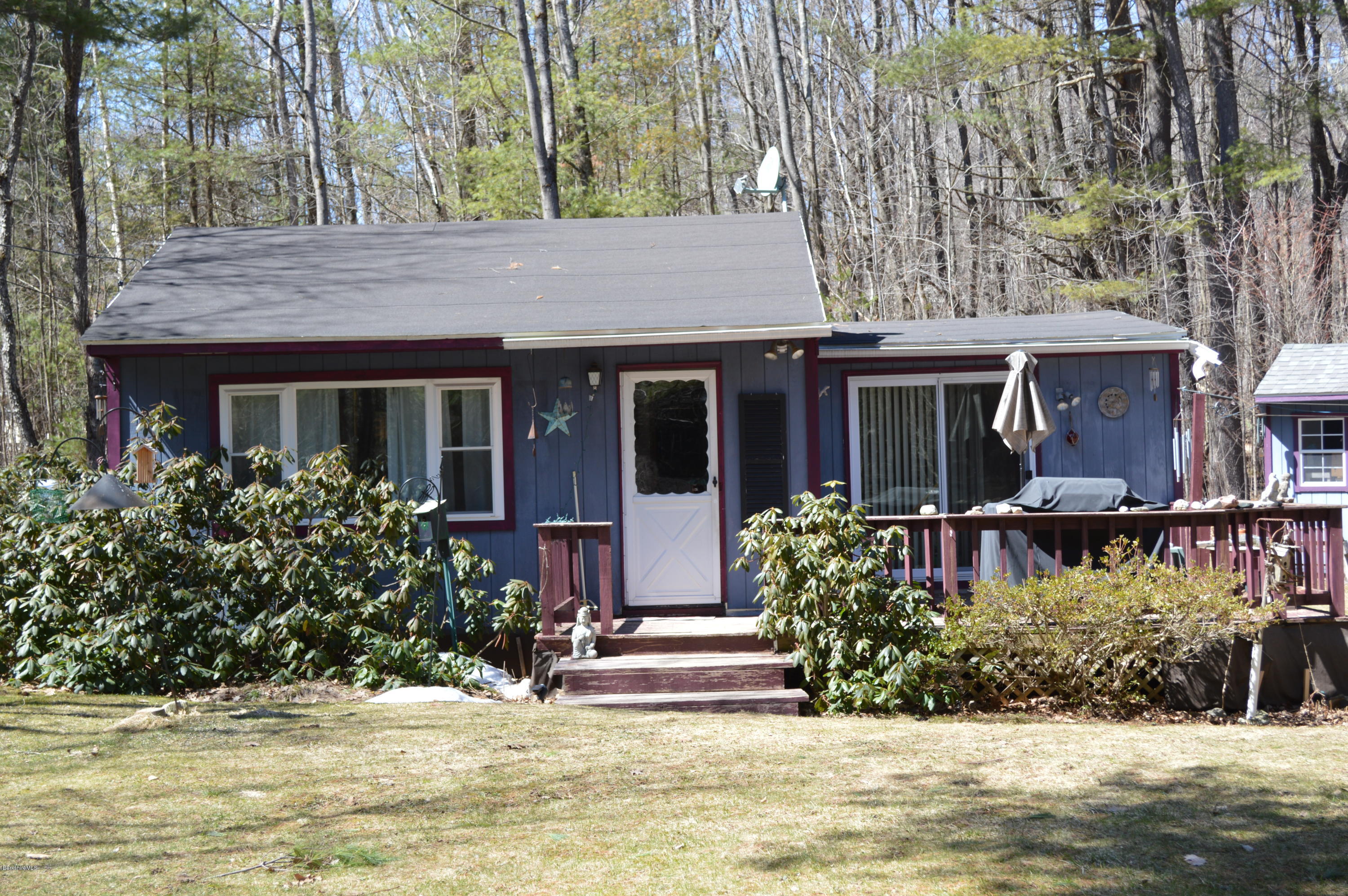 81 Peterson Road Becket, MA 01223 - Photo 5 of 24 a front view of a house with a yard