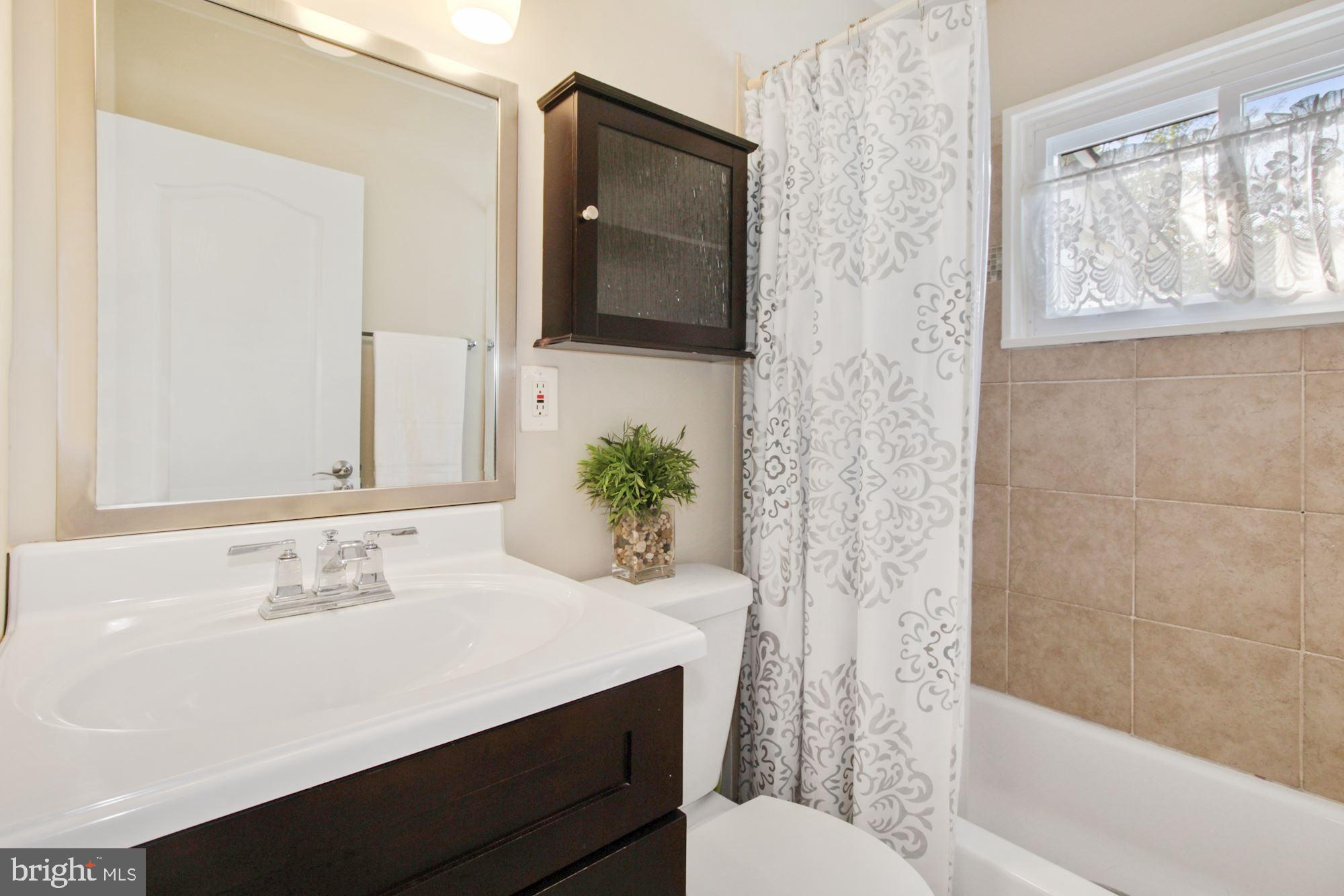 937 Vanderwood Road Baltimore, MD 21228 - Photo 14 of 28 Beautiful bathroom w full sized tub & shower