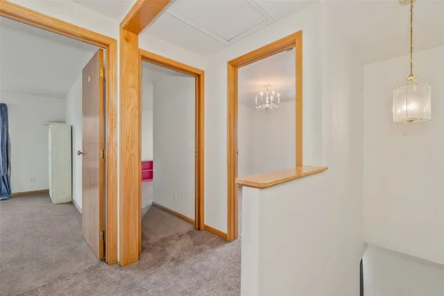 a view of a room with wooden floor and windows