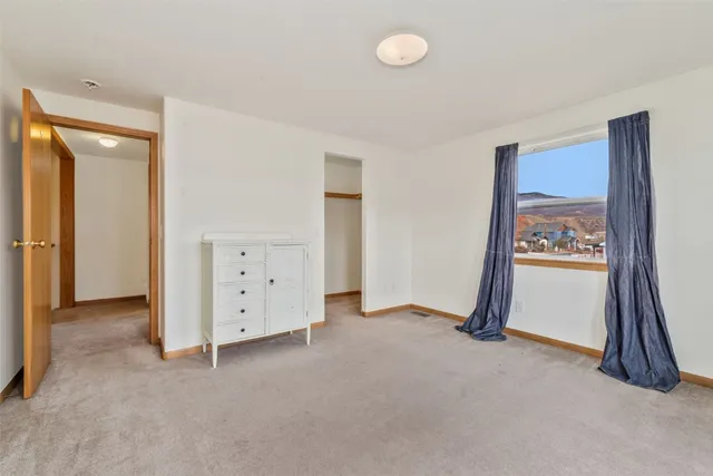 a view of a balcony with wooden floor and brick walls