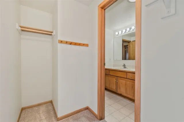 a view of a red door and wooden floor
