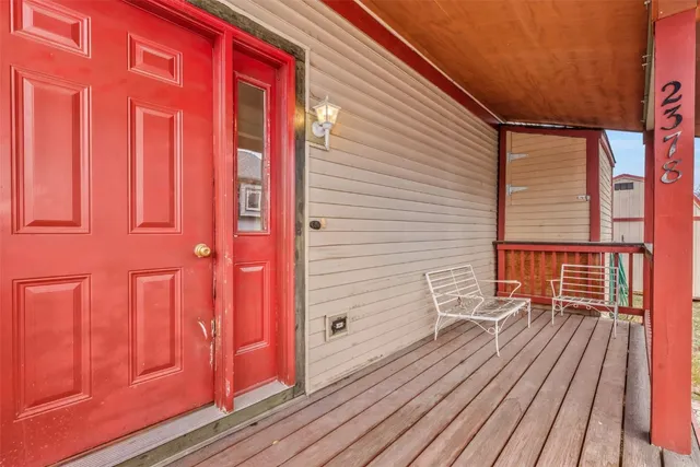 a view of a house with wooden fence
