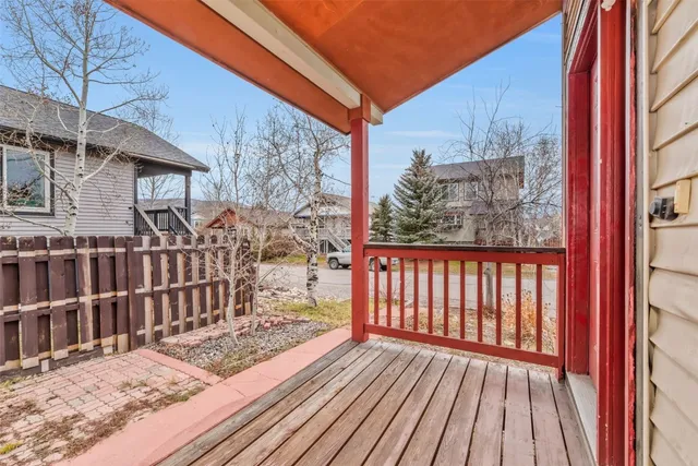 a view of a house with snow on the road