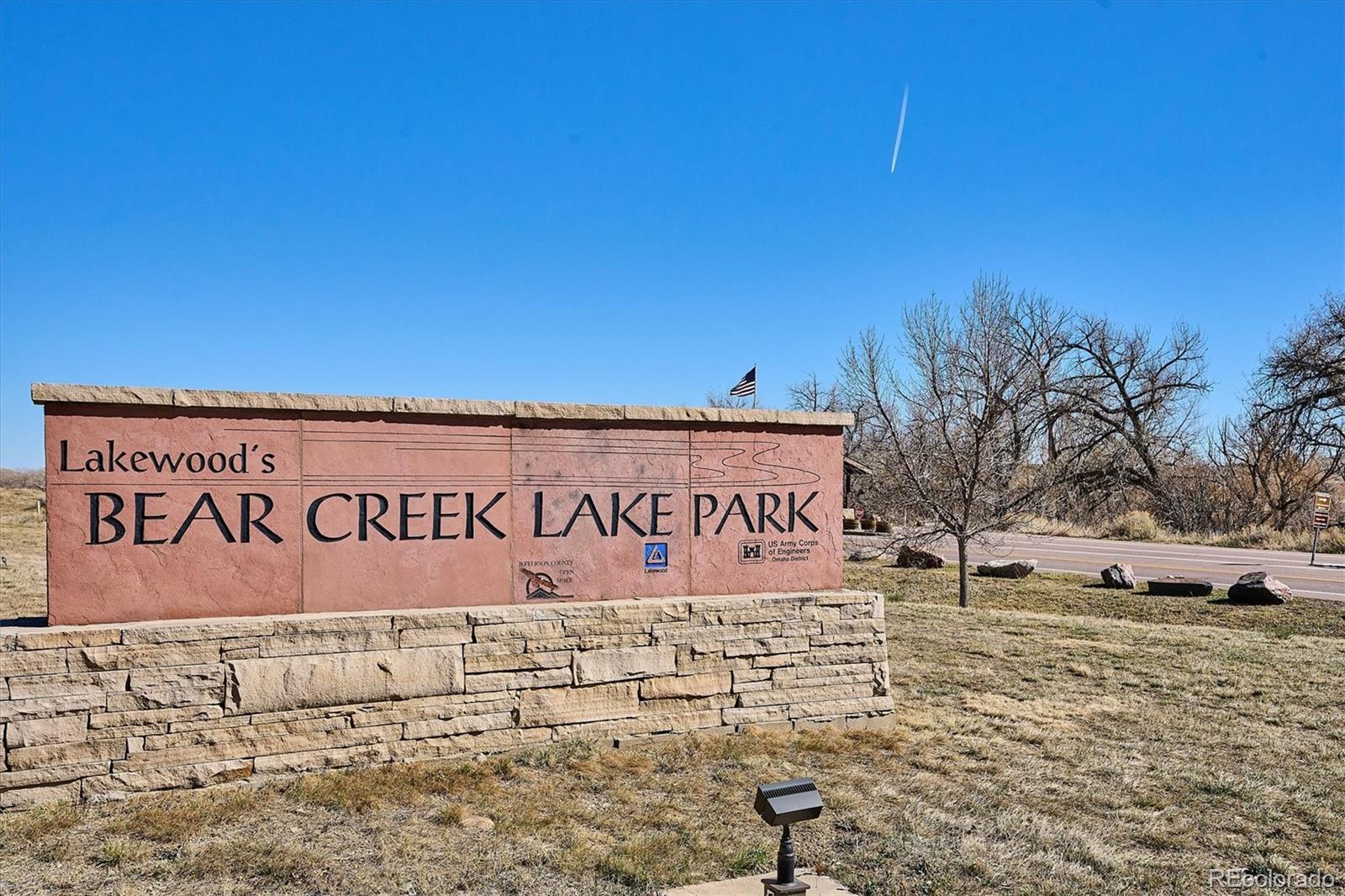 4143 South Deframe Court Morrison, CO 80465 - Photo 6 of 48 a sign of golf club on a wall