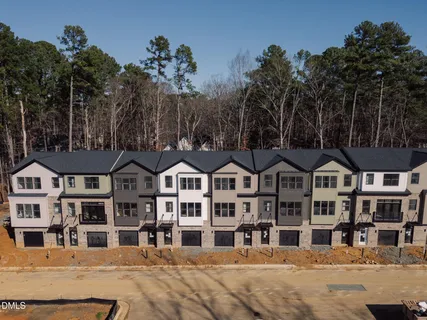 a front view of a house with a street