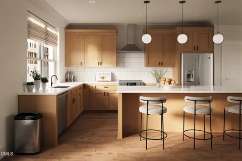 a kitchen with a sink cabinets and window