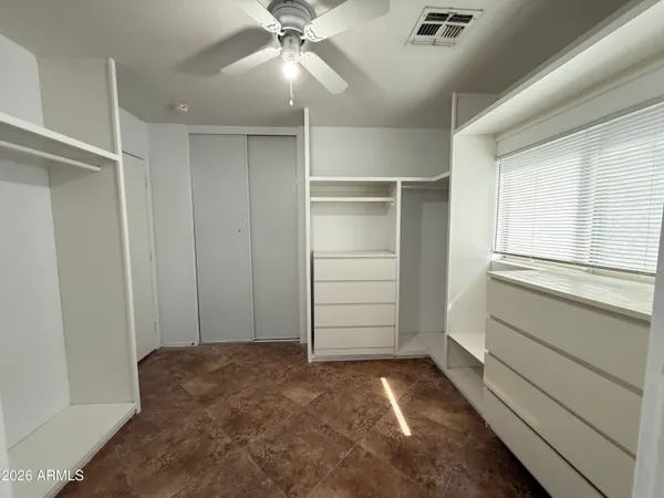 a view of an empty walk in closet