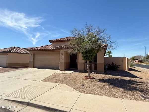 a house with palm tree in front of it