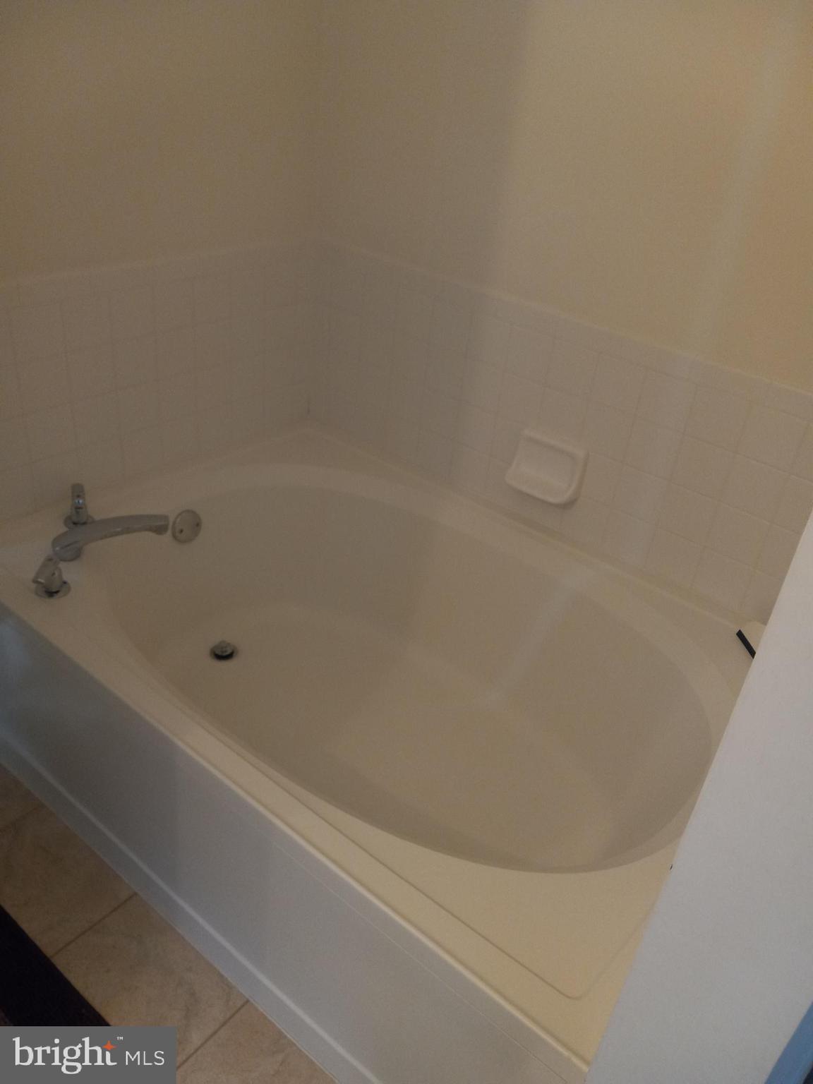 13 Ashley Drive Delran, NJ 08075 - Photo 20 of 39 a close up of a bathtub