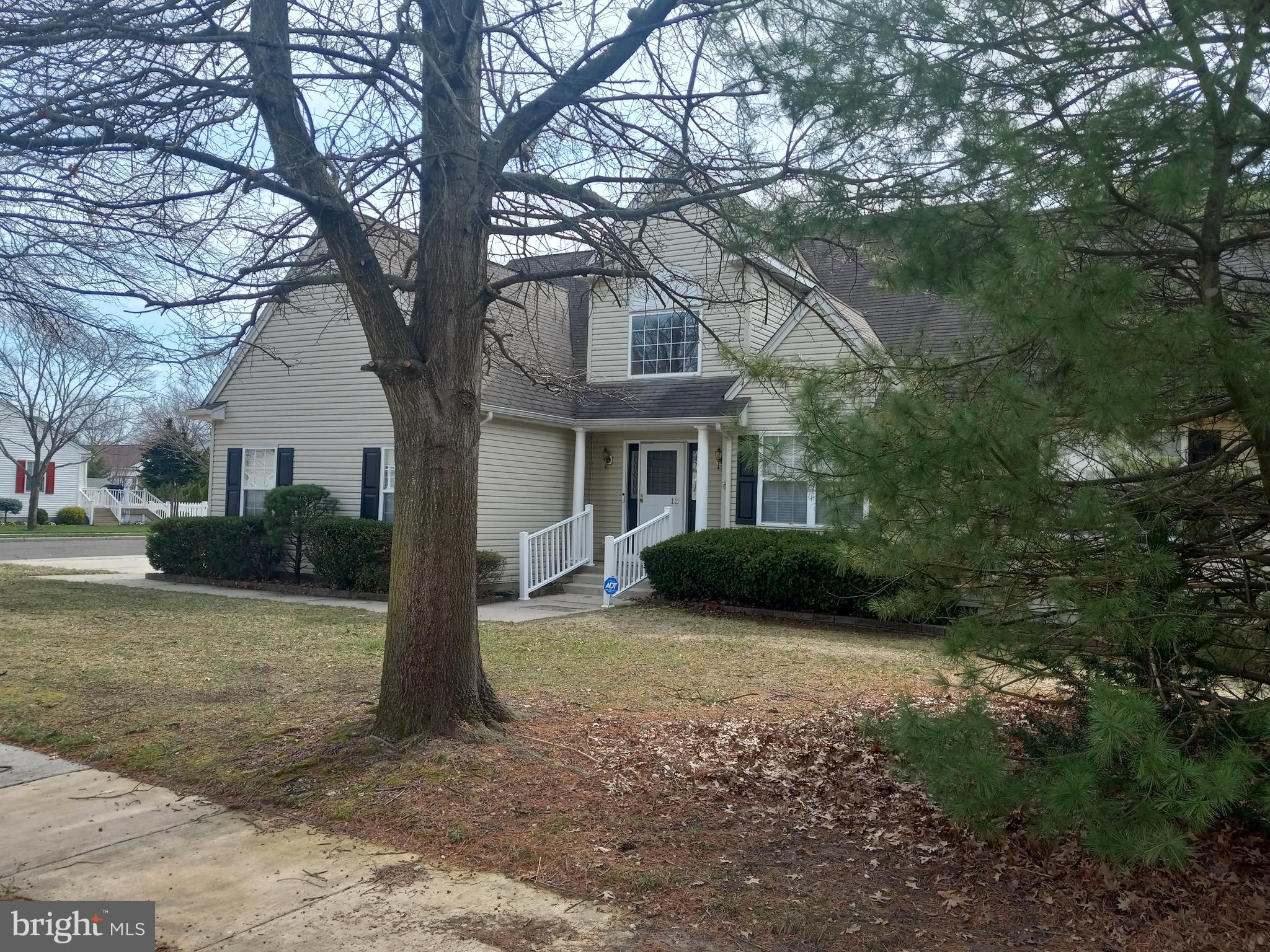 13 Ashley Drive Delran, NJ 08075 - Photo 3 of 39 a view of a yard in front of a house with large tree