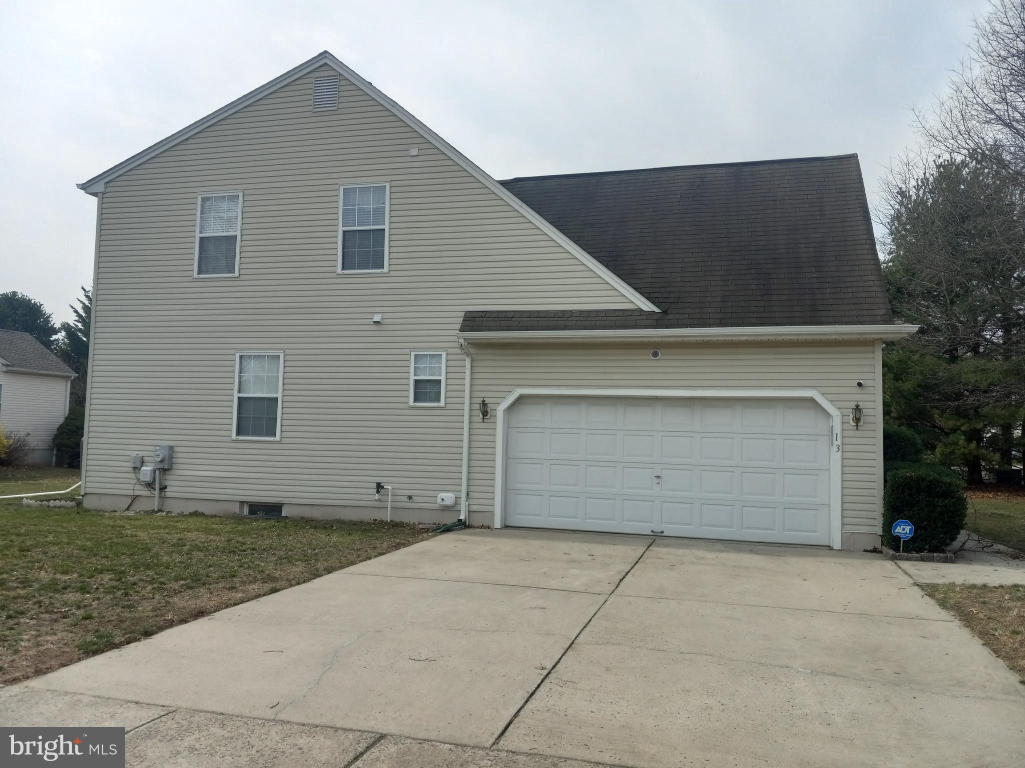13 Ashley Drive Delran, NJ 08075 - Photo 7 of 39 a front view of a house with a garage