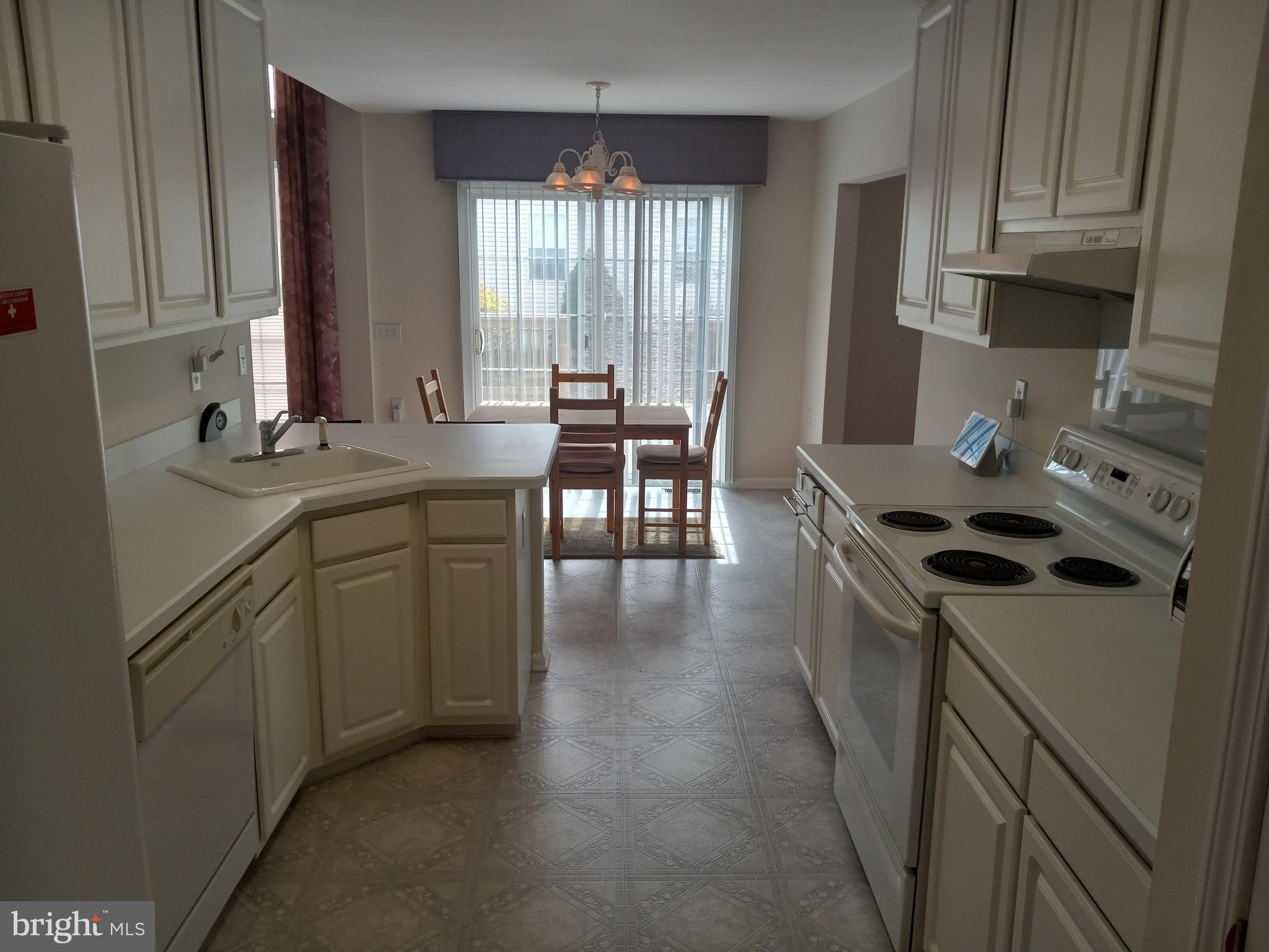 13 Ashley Drive Delran, NJ 08075 - Photo 9 of 39 a kitchen with a sink stove and cabinets