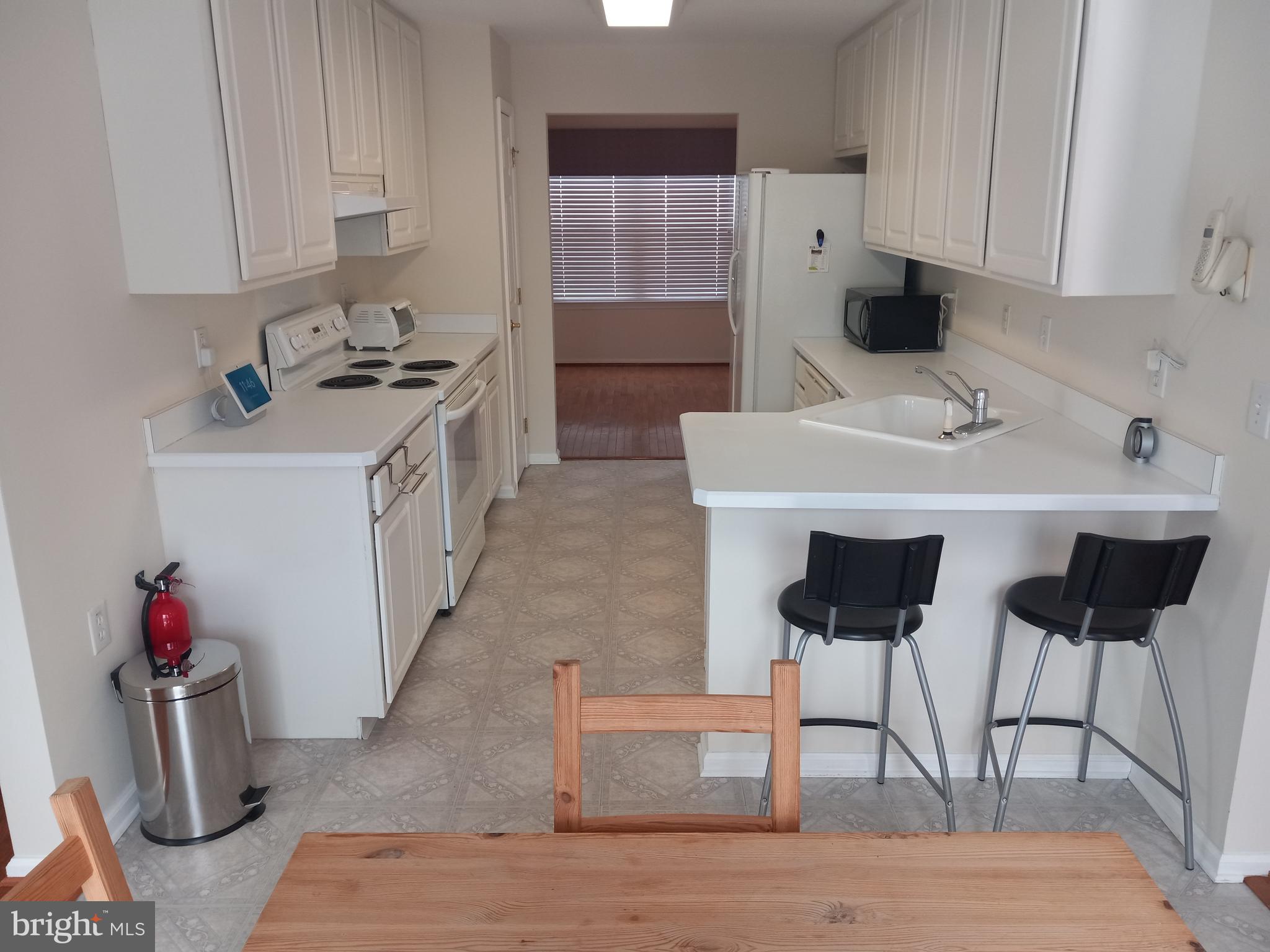 13 Ashley Drive Delran, NJ 08075 - Photo 10 of 39 a kitchen with stainless steel appliances a sink and a refrigerator