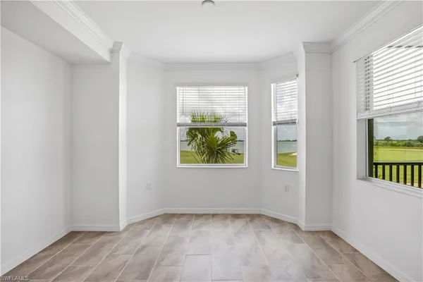 a kitchen with stainless steel appliances granite countertop a sink refrigerator and cabinets