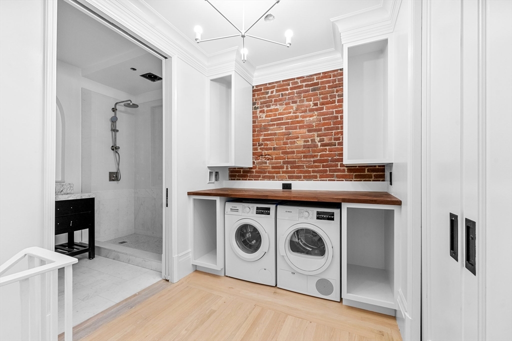 320 Tappan Street, Unit 1 Brookline, MA 02445 - Photo 9 of 10 a view of a livingroom with washer and dryer