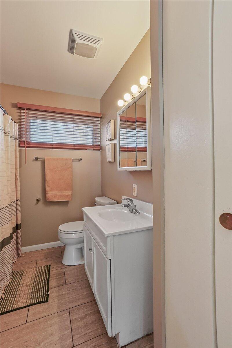 3340 Maple Drive Highland, IN 46322 - Photo 12 of 29 a bathroom with a sink a toilet and shower