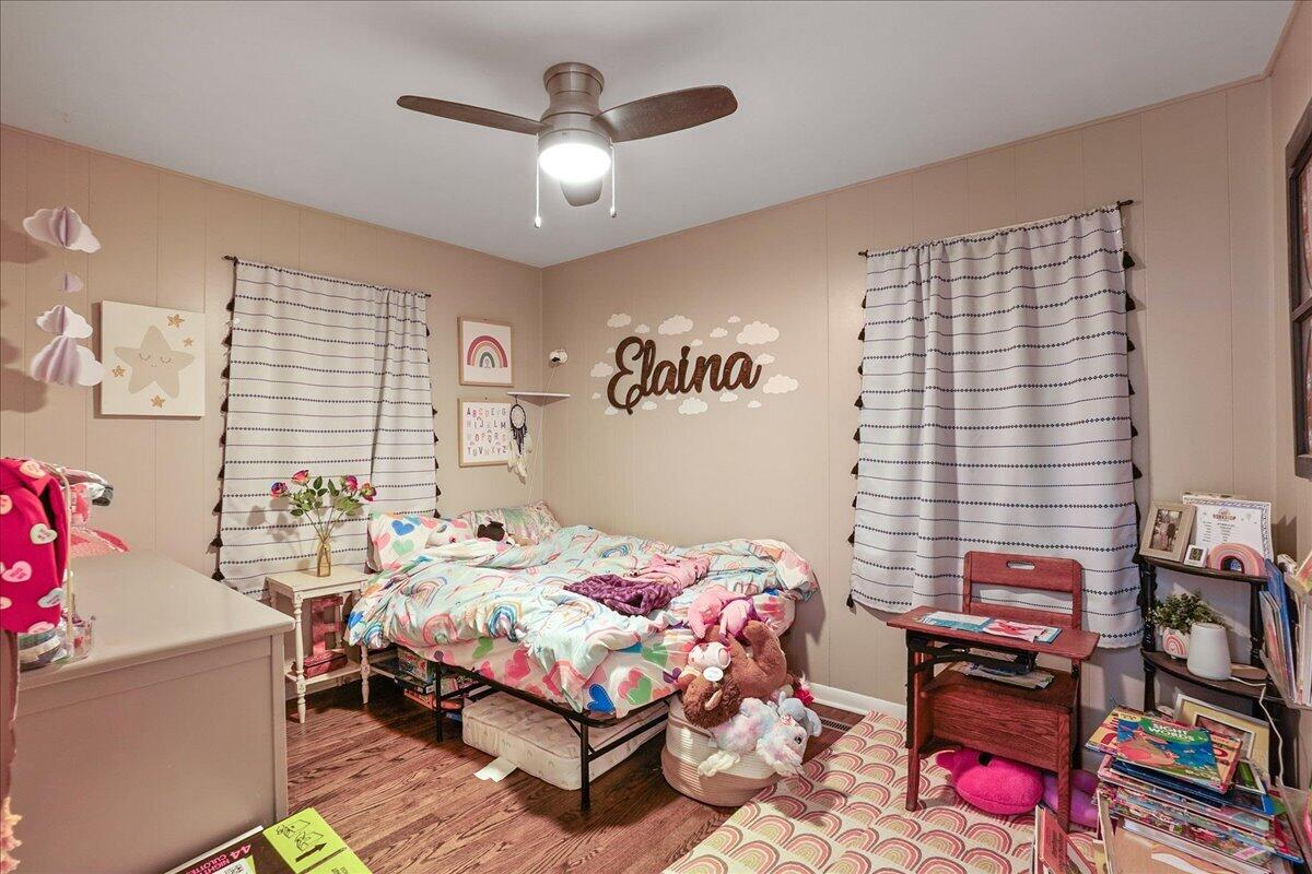 3340 Maple Drive Highland, IN 46322 - Photo 13 of 29 a bedroom with a bed and a chandelier