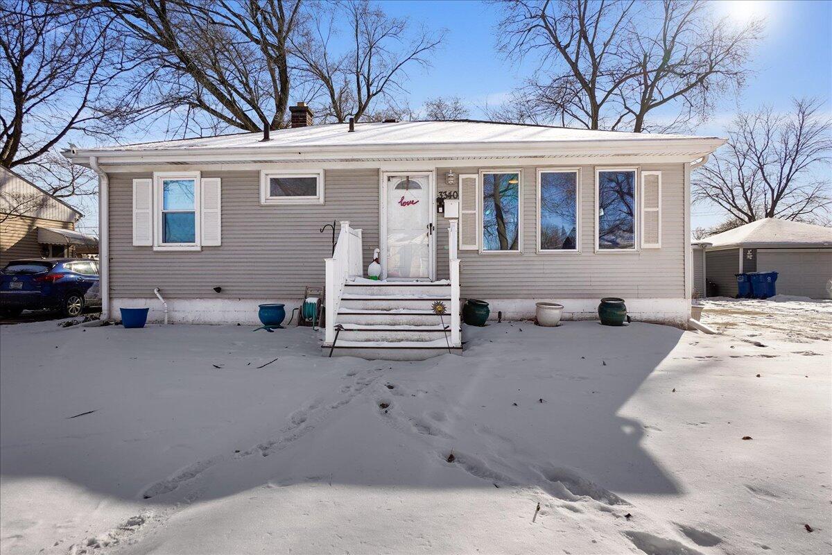 3340 Maple Drive Highland, IN 46322 - Photo 2 of 29 a view of a white house with large windows