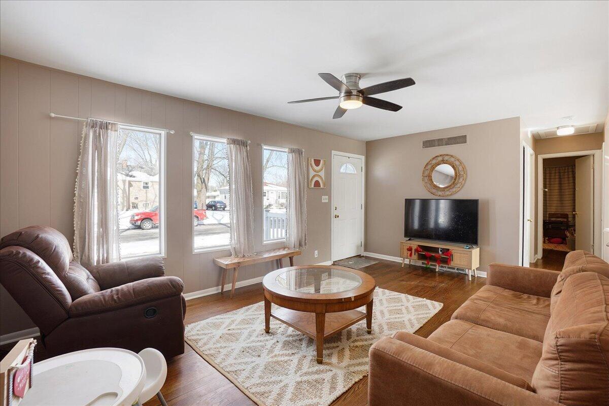 3340 Maple Drive Highland, IN 46322 - Photo 5 of 29 a living room with furniture a large window and a flat screen tv