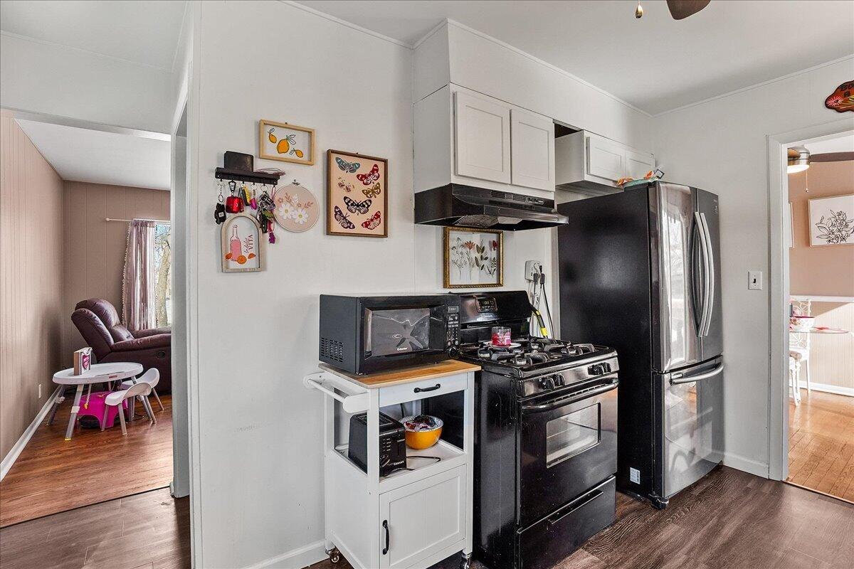 3340 Maple Drive Highland, IN 46322 - Photo 7 of 29 a kitchen with stainless steel appliances granite countertop a refrigerator and a stove