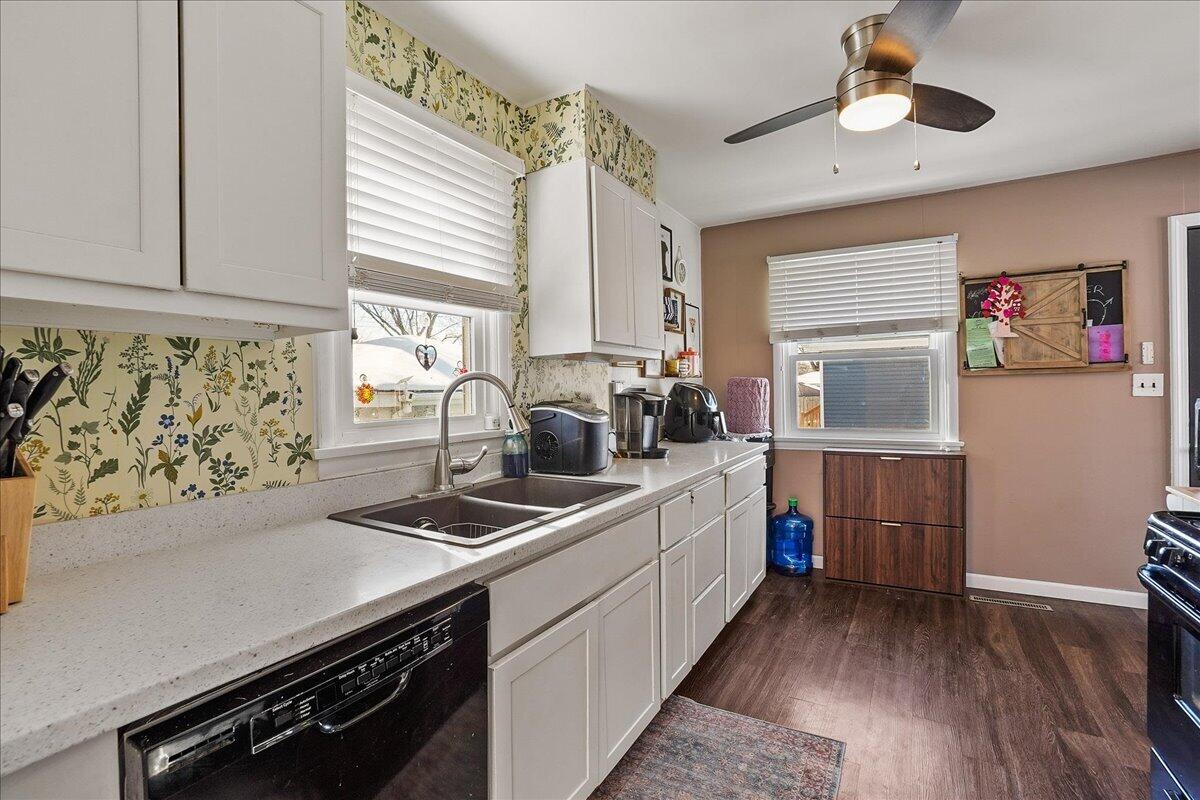 3340 Maple Drive Highland, IN 46322 - Photo 9 of 29 a kitchen with a sink stove and cabinets