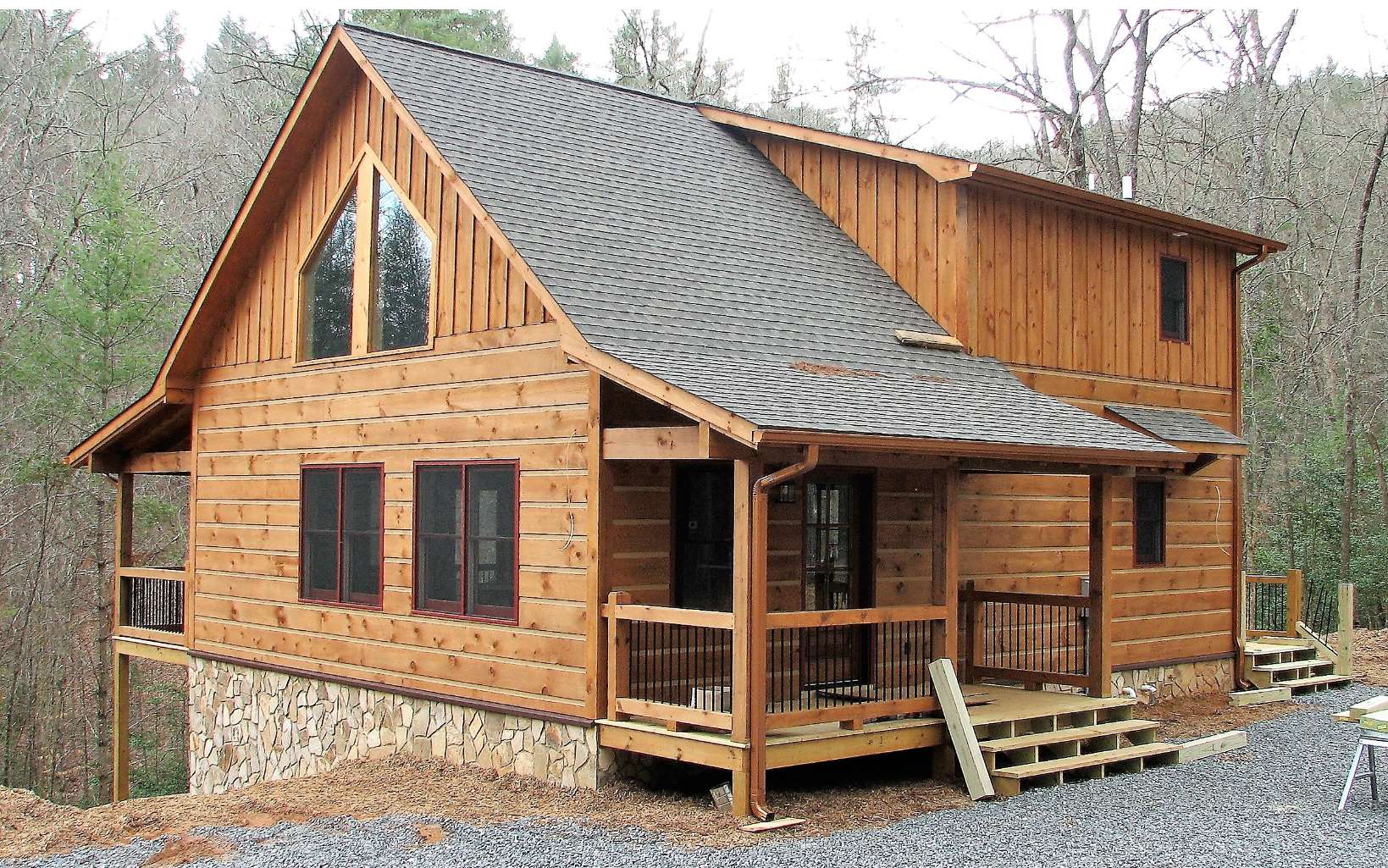 7414 Aska Road Blue Ridge, GA 30513 - Photo 1 of 1 a view of a house with wooden deck