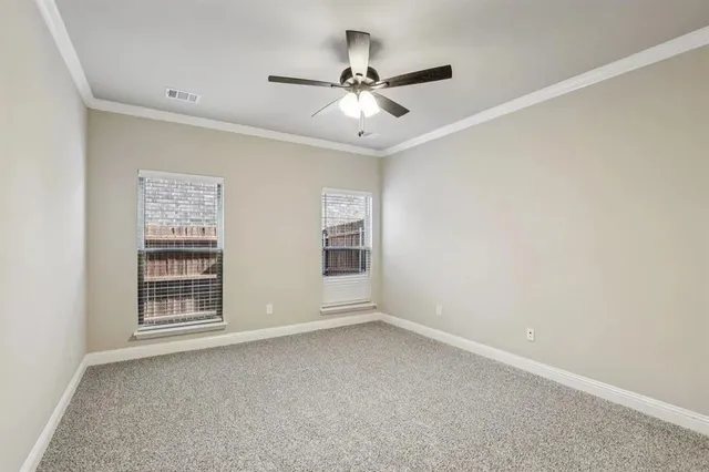 a kitchen with granite countertop a sink stainless steel appliances and white cabinets