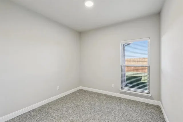an empty room with closet area