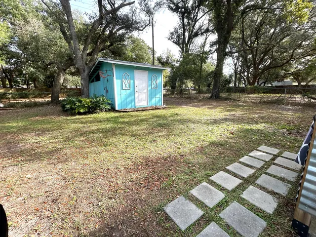 a backyard of a house with lots of green space