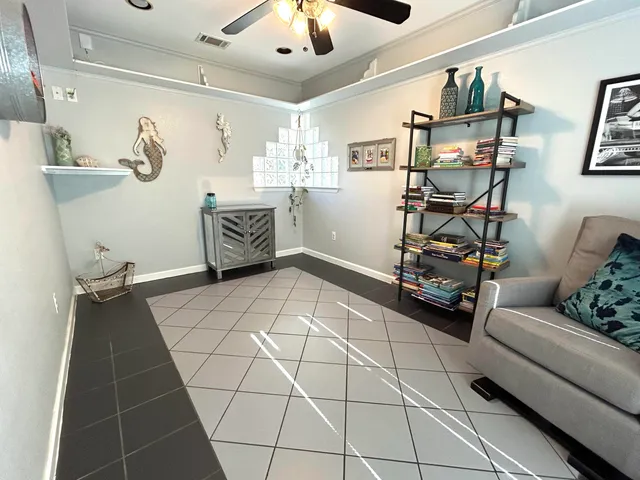 a bedroom with furniture and a chandelier