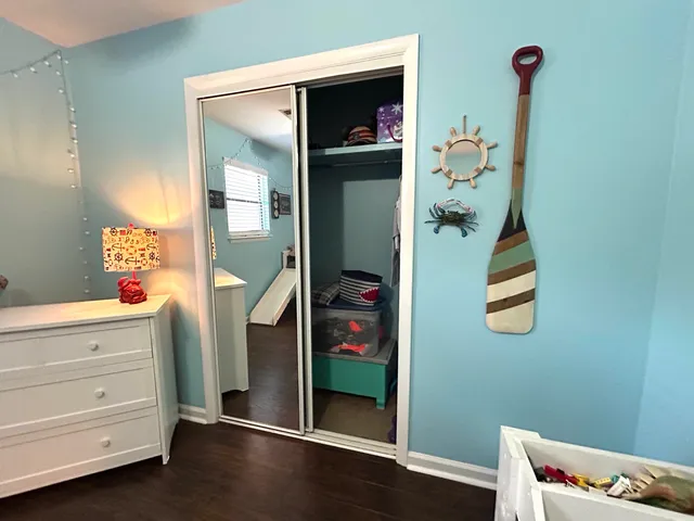 a room with window and closet