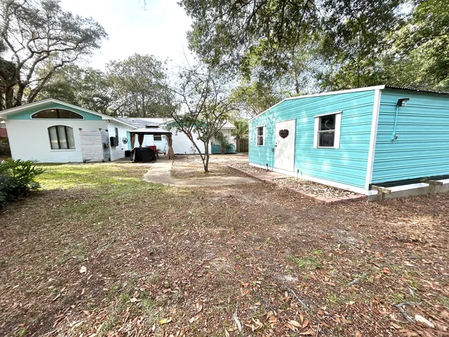 a view of a house with a yard