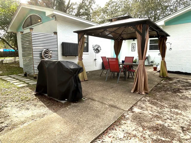 a view of a two chairs in the patio