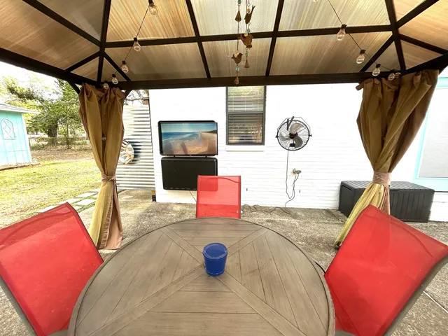 a view of living room with furniture and flat screen tv