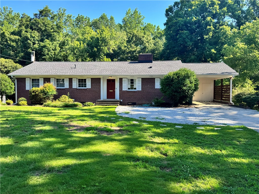 252 Riggs Drive Clemson, SC 29631 - Photo 1 of 45 A well-maintained ranch home with a carport and ample greenery offers inviting curb appeal.